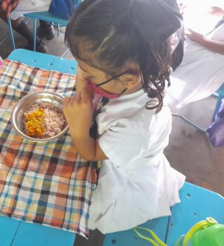 Student prepares to eat their daily school meal.
